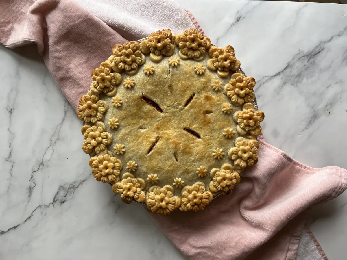 Baked pie with a delicate pastry flower border